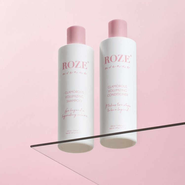 szampon i odżywyka Roze Avenue - glamorous volumizing shampoo i conditioner ustawione obok siebie na szklanej półce