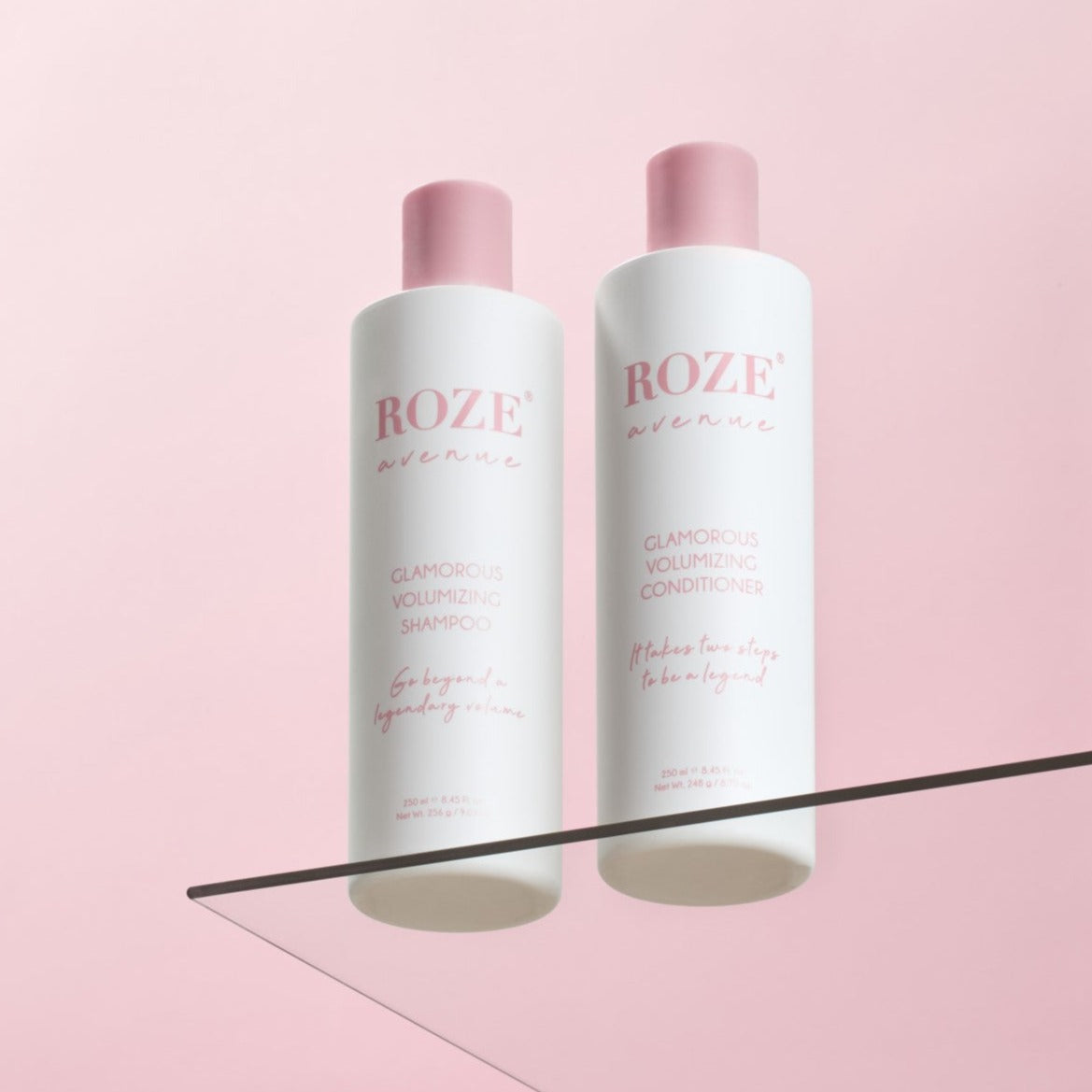 szampon i odżywyka Roze Avenue - glamorous volumizing shampoo i conditioner ustawione obok siebie na szklanej półce